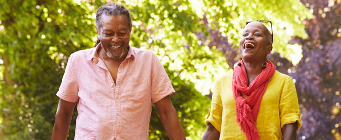 Smiling older couple enjoying retirement outdoors