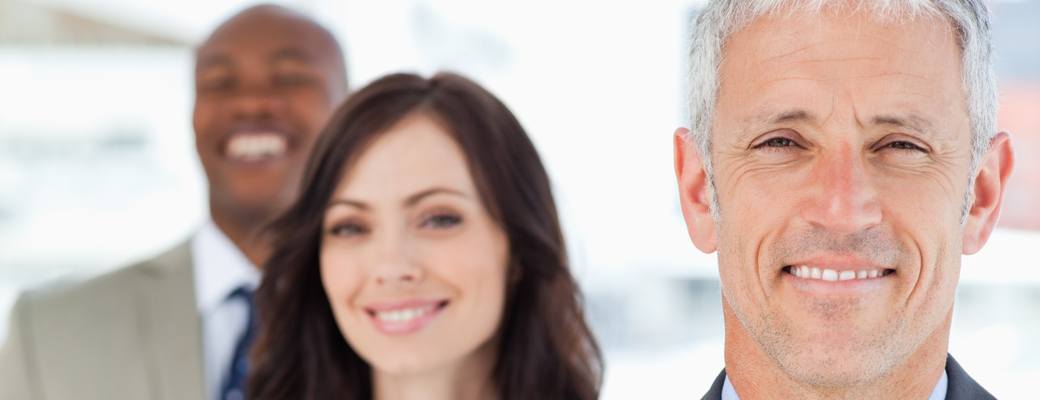 Professional team of smiling businesspeople